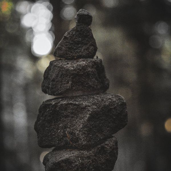 A balanced stack of stones on a serene background, symbolizing harmony.
